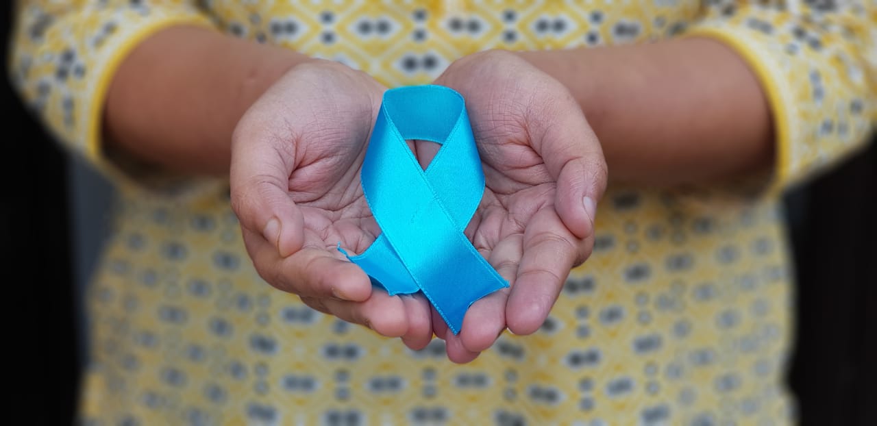 Cervical cancer ribbon in hands